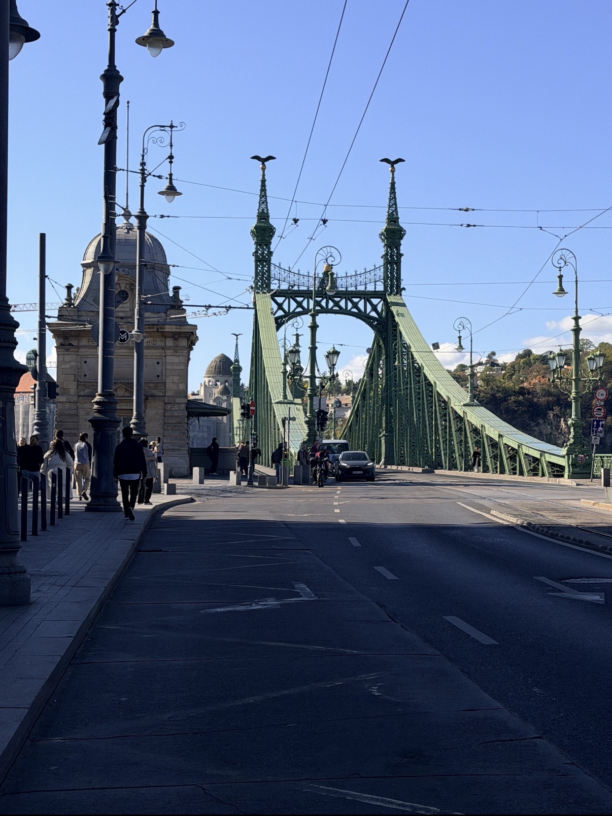 A green suspension bridge in Budapest